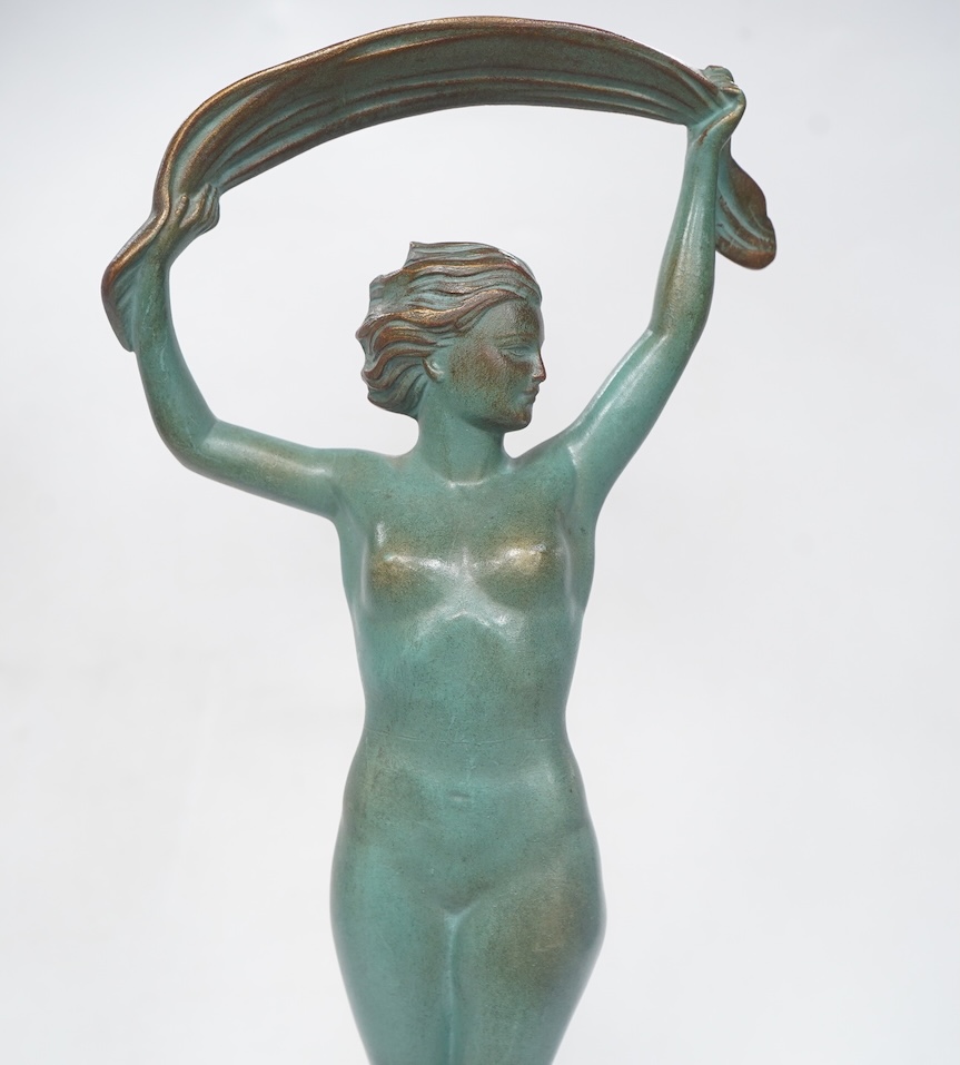 A French Art Deco bronze model of a dancer, green patination, on black marble base. 33cm high. Condition - minor chip to base